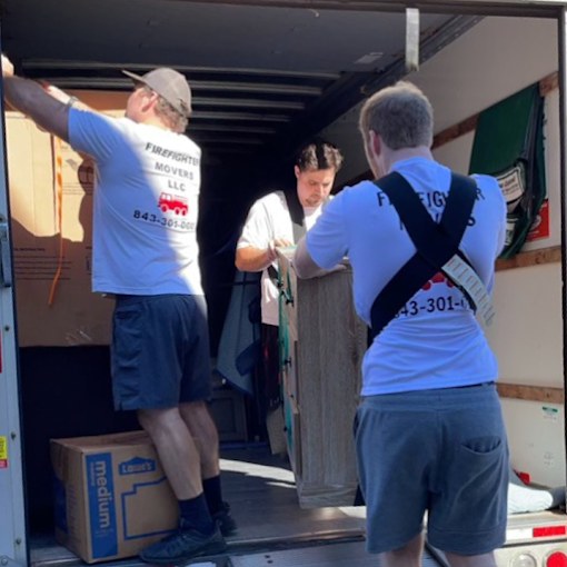 Firefighter Movers loading a moving truck
